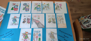 kolorowanki z numerem alarmowym pomalowane przez dzieci