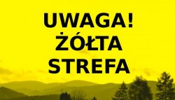 plakat z napisem uwaga żółta strefa